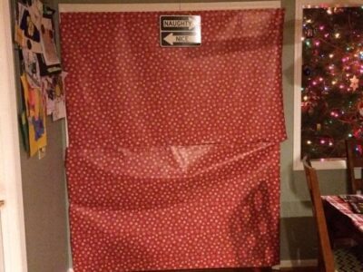 A doorway covered in wrapping paper is one no-spend tradition one family uses during the holiday season. Credit: Amy Lantz