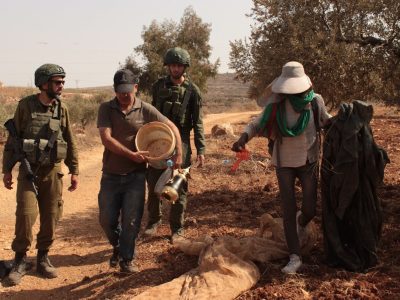Faz3a volunteers being arrested by Israeli soldiers in the West Bank of Palestine