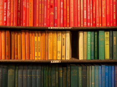 Native American Heritage Month, stack of multi-colored books, Credit: Jason Leung for Unsplash