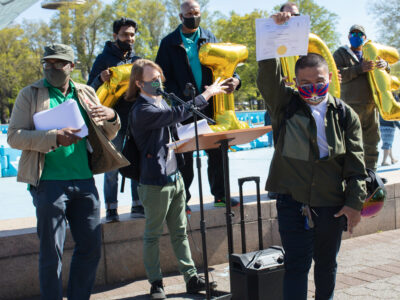 Member-owners of The Driver Cooperative ceremoniously gather to receive shares of the operation.