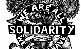 Print of sunflowers with text reading, "Solidarity. We are all we really have."